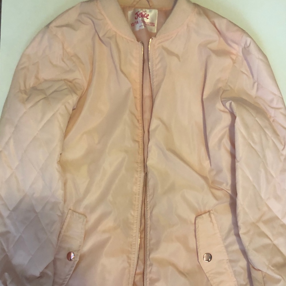 A peach flight jacket